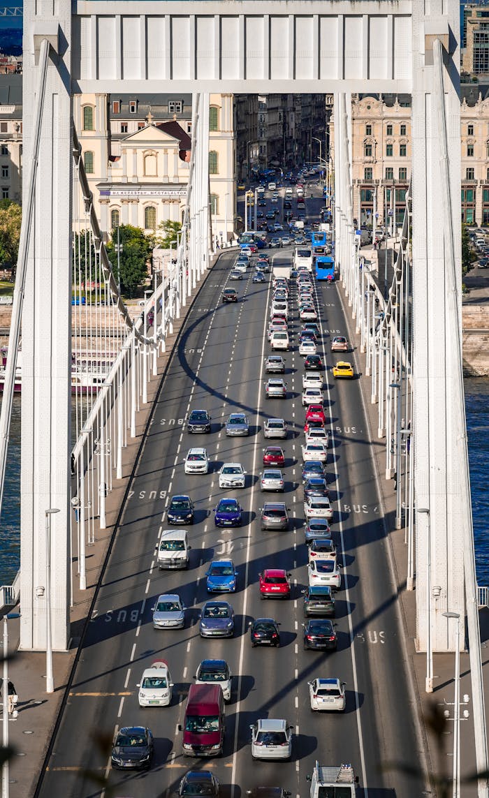 our-services-2 Aerial view of significant traffic on Budapest's iconic Elisabeth Bridge, showcasing urban transport.