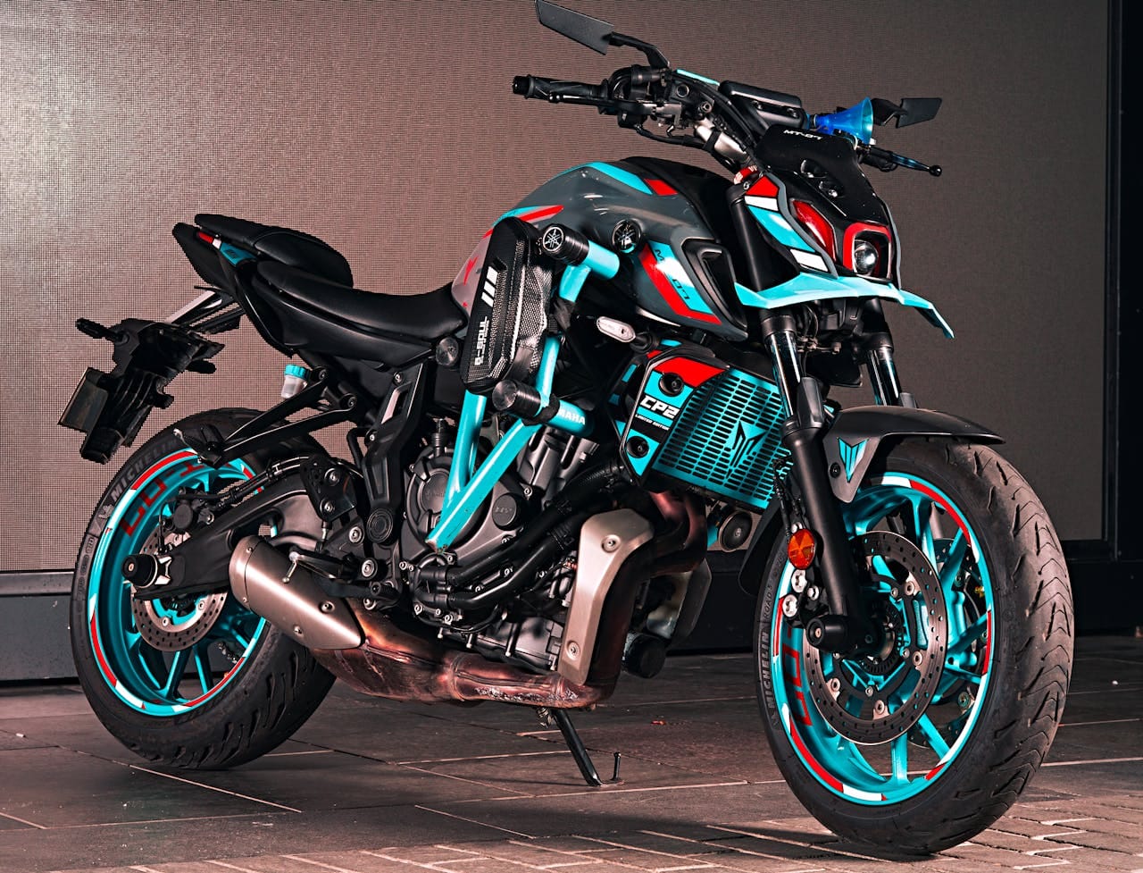 gallery-1 Stylish motorcycle with vibrant colors, parked in an urban setting in İstanbul, Türkiye.